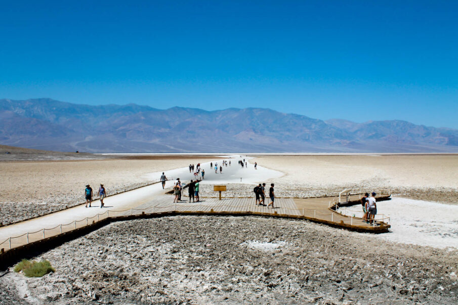 Tourists walk in Badwater Basin in 119°F