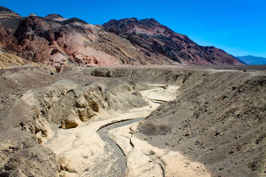 Dry river bed and mountainous terrain from the viewpoint of Artist's Drive in Death Valley National Park